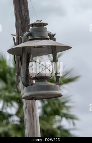 A kerosene lantern mounted on a pole photographed  from a lower angle Stock Photo