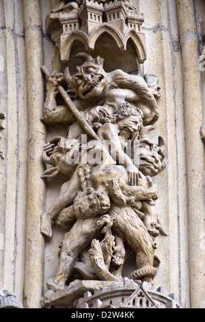 Detail of a sculpture on the facade of Notre Dame de Paris cathedral - Paris, France Stock Photo