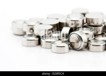 Pile of button cell batteries on white background Stock Photo