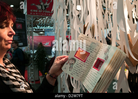 Leipzig, Germany, a visitor looks at design studies at the Leipzig Book Fair Stock Photo