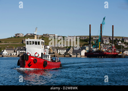 The dive boat, 'John L' heads out of Stromness harbour on it's way to Scapa Flow, Orkney Islands Stock Photo