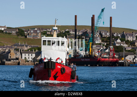 The dive boat, 'John L' heads out of Stromness harbour on it's way to Scapa Flow, Orkney Islands Stock Photo