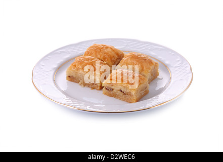 Turkish traditional dessert Baklava served in porcelain dish isolated on white with clipping path Stock Photo