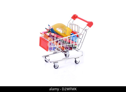 Color pencils and some stationery in miniature shopping cart isolated on white background Stock Photo