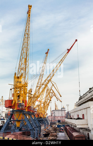 port cranes against blue sky Stock Photo