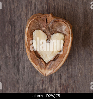 Open walnut with a heart shaped interior. Stock Photo