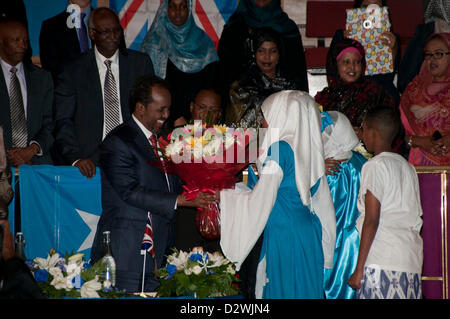 London, UK. 2nd Feb, 2013. British Somali children present His Excellency Mr Hassan Sheikh Mohamud President of the Federal Republic of Somalia with gifts and flowers before he talks to British Somalis at the Central Methodist Hall. Stock Photo