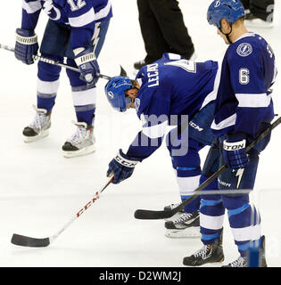 Feb. 2, 2013 - Tampa, Florida, U.S. - DIRK SHADD   |   Times  .Tampa Bay Lightning center Vincent Lecavalier (4) is slow getting up as he appears to have been injured in the final seconds as the New York Rangers defeat the Lightning at the Tampa Bay Times Forum in Tampa Saturday evening 02/02/13. On right is defenseman Sami Salo (6) (Credit Image: © Dirk Shadd/Tampa Bay Times/ZUMAPRESS.com) Stock Photo