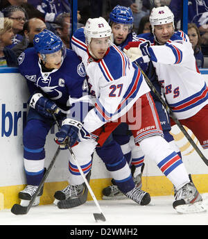 Feb. 2, 2013 - Tampa, Florida, U.S. - Tampa Bay Lightning center VINCENT LECAVALIER (4) and left wing CORY CONACHER (89) battle along the boards against New York Rangers defenseman RYAN MCDONAGH (27) and right wing ARRON ASHAM (45) during first period action at the Tampa Bay Times Forum Saturday evening. (Credit Image: © Dirk Shadd/Tampa Bay Times/ZUMAPRESS.com) Stock Photo