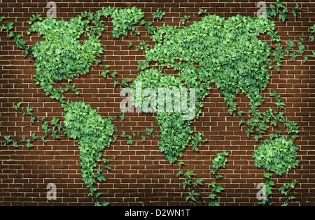 Global leaf map in the shape of growing green vine plant on a red brick wall as a world concept of network connections with the Stock Photo
