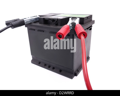 Car battery with two jumper cables clipped to the terminals shot over white Stock Photo