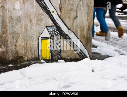 Urban graffiti street art illustration on concrete wall east London England Europe Stock Photo