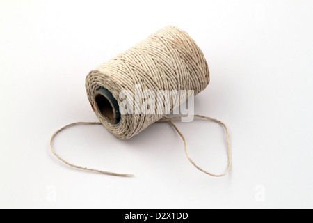 Ball of string or twine on a plain white background Stock Photo
