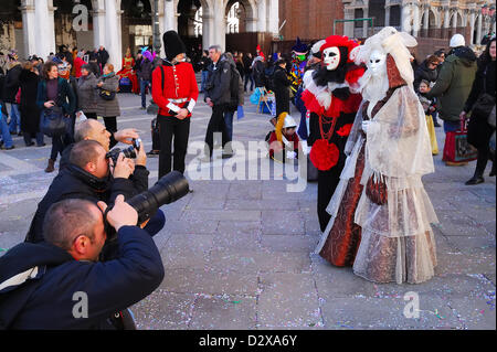 February 3th, 2013 : Venice Carnival 2013. The streets of Venice are teeming with colourful fancy-dressed people. The 2013 Carnival opened on January 26th and will finish on February 12th. The theme of this year's Carnival is 'Live in colour.' Stock Photo
