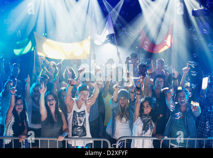 Portrait of enthusiastic crowd at concert Stock Photo