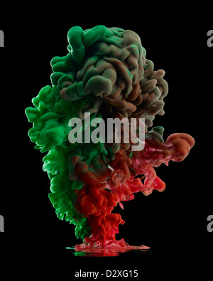 Green and red smoke cloud Stock Photo