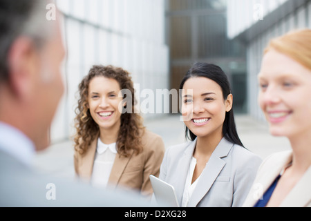 Smiling business people talking Stock Photo