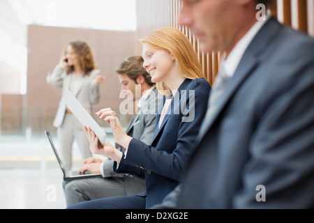 Business people using laptop and digital tablet Stock Photo