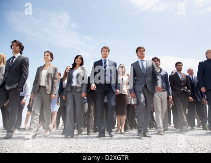 Crowd of business people walking Stock Photo