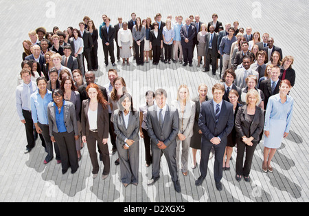 Portrait of smiling business people forming circle Stock Photo