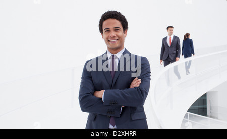 Portrait of smiling businessman on elevated walkway Stock Photo