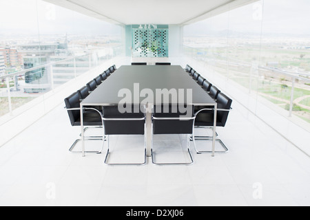 Empty conference room overlooking city Stock Photo