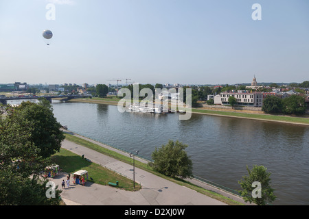 Hit air balloon over River Wisla below Wawel hill and castle in the centre of Krakow, Poland Stock Photo