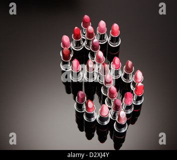 Multicolor lipsticks forming dollar sign Stock Photo