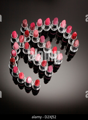 Multicolor lipsticks forming euro symbol Stock Photo