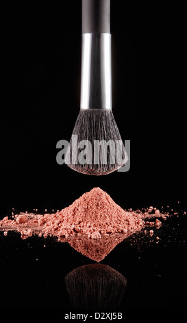 Makeup brush over coral blush powder Stock Photo