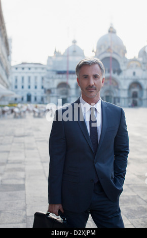 Portrait of confident businessman in St. Mark's Square in Venice Stock Photo