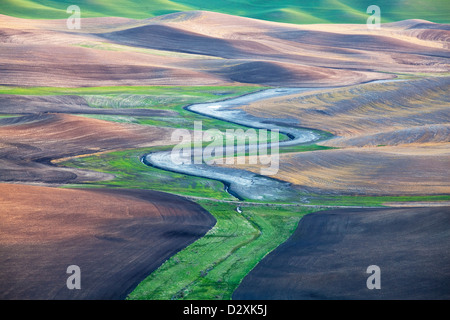 Aerial view of river winding through landscape Stock Photo