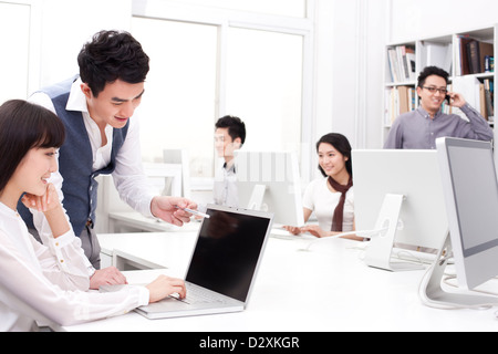 Busy office workers in studio Stock Photo