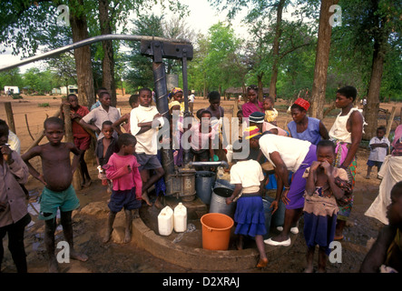 Zimbabwean people, women and children, pumping water from well, water well, well water, village of Mahenye, Manicaland Province, Zimbabwe, Africa Stock Photo