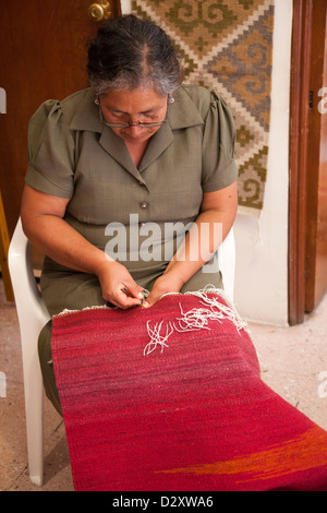 Woman Stitching Woven Rug in Shop in Oaxaca - Mexico Stock Photo - Alamy