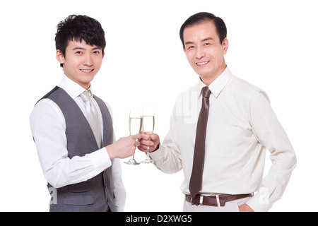 Businessmen with champagne flutes toasting Stock Photo