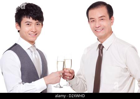 Businessmen with champagne flutes toasting Stock Photo