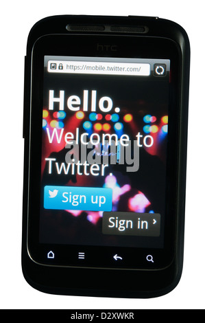 Twitter social networking and messaging app displayed on a mobile phone. Stock Photo