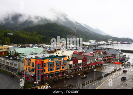 Colorful buildings in Ketchikan, Alaska with mist covered mountains in background Stock Photo