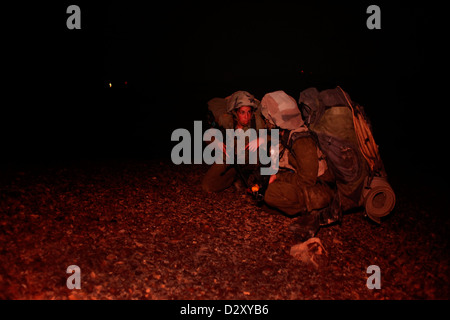 Israeli female soldiers from the 727th Eitam Field Intelligence Battalion of the Combat Intelligence Collection Corps during advance training at night close to the border with Egypt in the southern Negev desert Israel Stock Photo