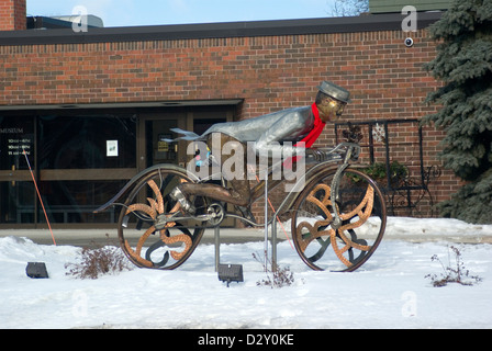 'Late for a Date' bicyclist metal sculpture at Rahr-West Museum Manitowoc Wisconsin Stock Photo