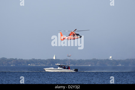 U.S. Coast Guard helicopter and boat rescue training on the St. Johns River in North Florida. Stock Photo