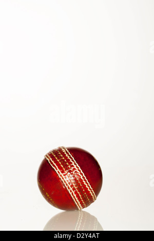 Cricket Ball, Sport of Cricket, Ball, Isolated, Red, Sport, Stitch, White, Leather, Single Object, Old, Photography, Color Image Stock Photo