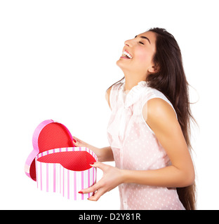 Image of pretty happy woman opening gift box isolated on white background, brunette female enjoying of present, cute teen girl Stock Photo