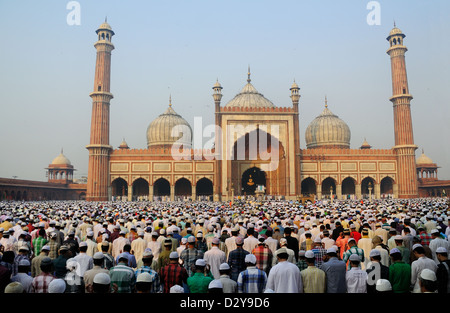 Thousands of Muslim people sitting inside and outside of the Mosque ...