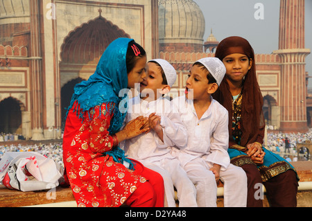 Last day of Ramadan at Jama Masjid in Old Delhi. Children happily talking just after Ramadan finished Stock Photo