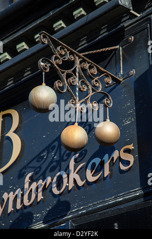 Original “Pawn-broker's sign” or three-ball symbol,  symbolic meaning of Lombard, in Blackpool, Lancashire, UK Stock Photo