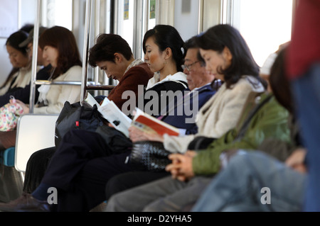 Kamakura, Japan, people are sitting in a train compartment Stock Photo