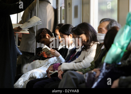 Kamakura, Japan, people are sitting in a train compartment Stock Photo