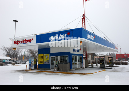 real canadian superstore gas bar petrol station in blizzard Saskatoon Saskatchewan Canada Stock Photo